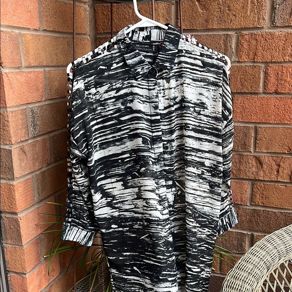 Black and white button down Shirt with unique sleeves.